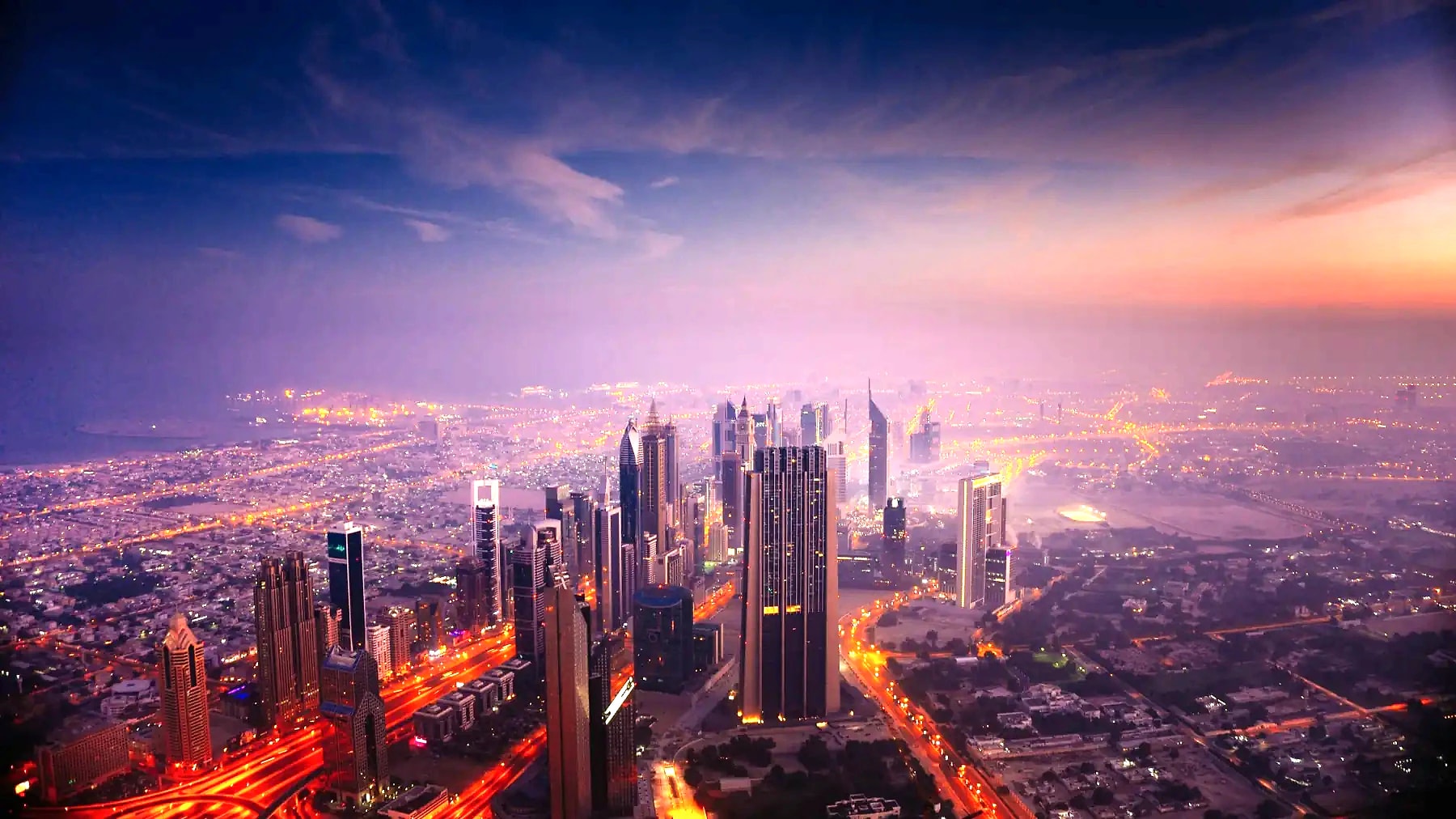 Dubai skyline at dusk, seen from above Sheikh Zayed Road